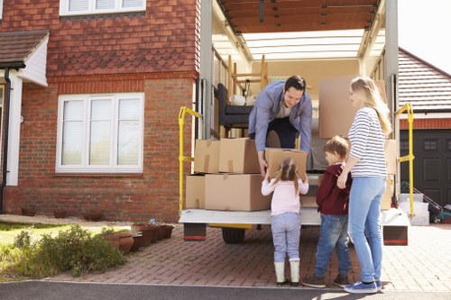 Professional movers packing boxes efficiently