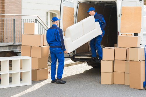 Professional movers handling household items