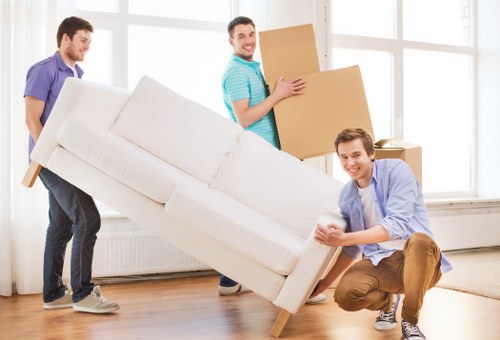 Happy family settling into their new home with House Movers Creekmouth