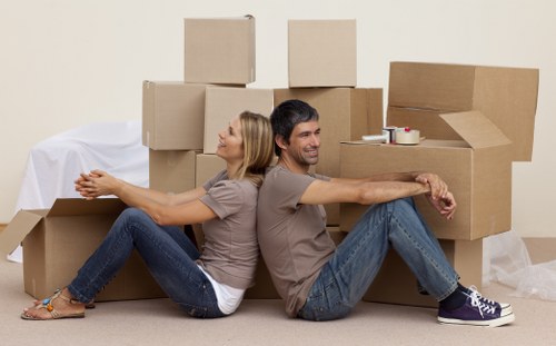 Movers unloading furniture at a new home in Borehamwood