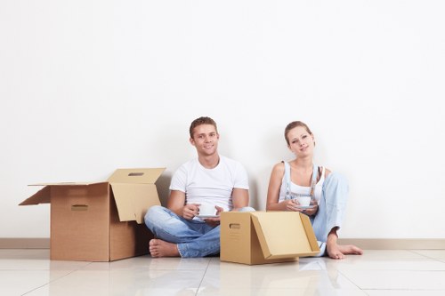 Satisfied family unpacking in their new Kingston Vale home