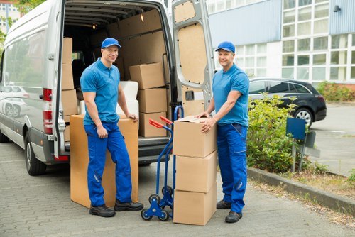 Professional movers handling furniture