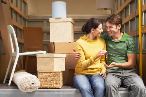 Movers transporting furniture in Hackney Wick