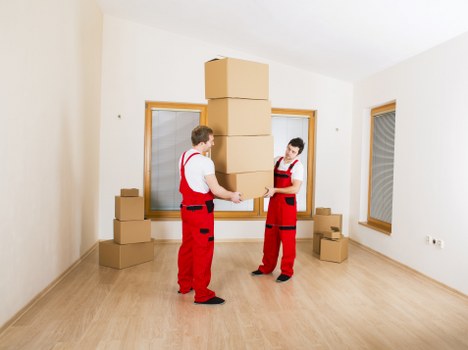 Movers unloading a truck at a new home in Redbridge